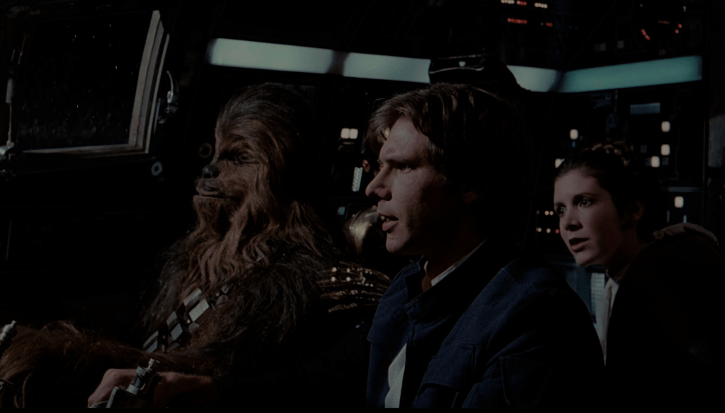 Peter Mayhew, Harrison Ford e Carrie Fisher in una scena del film  Star Wars: L'impero colpisce ancora (1980) diretto da George Lucas 